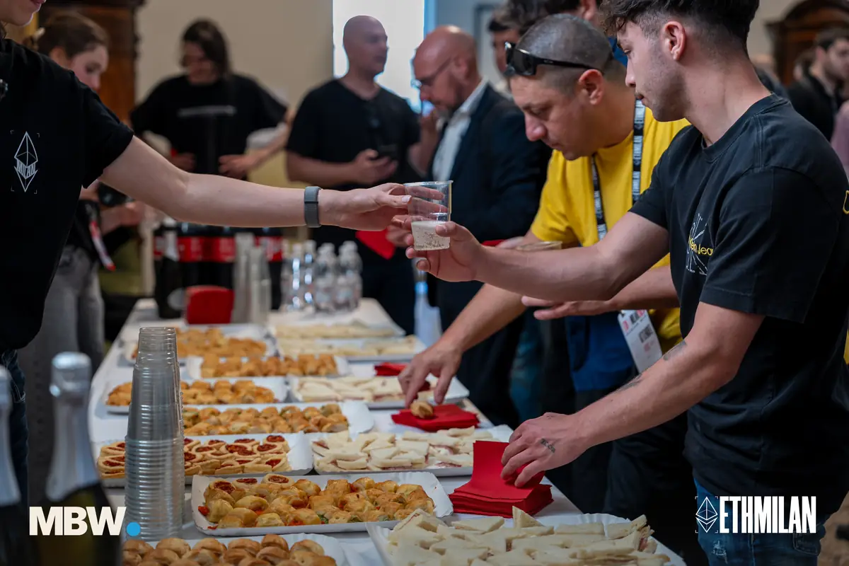 Attendees around the buffet table at ETHMilan